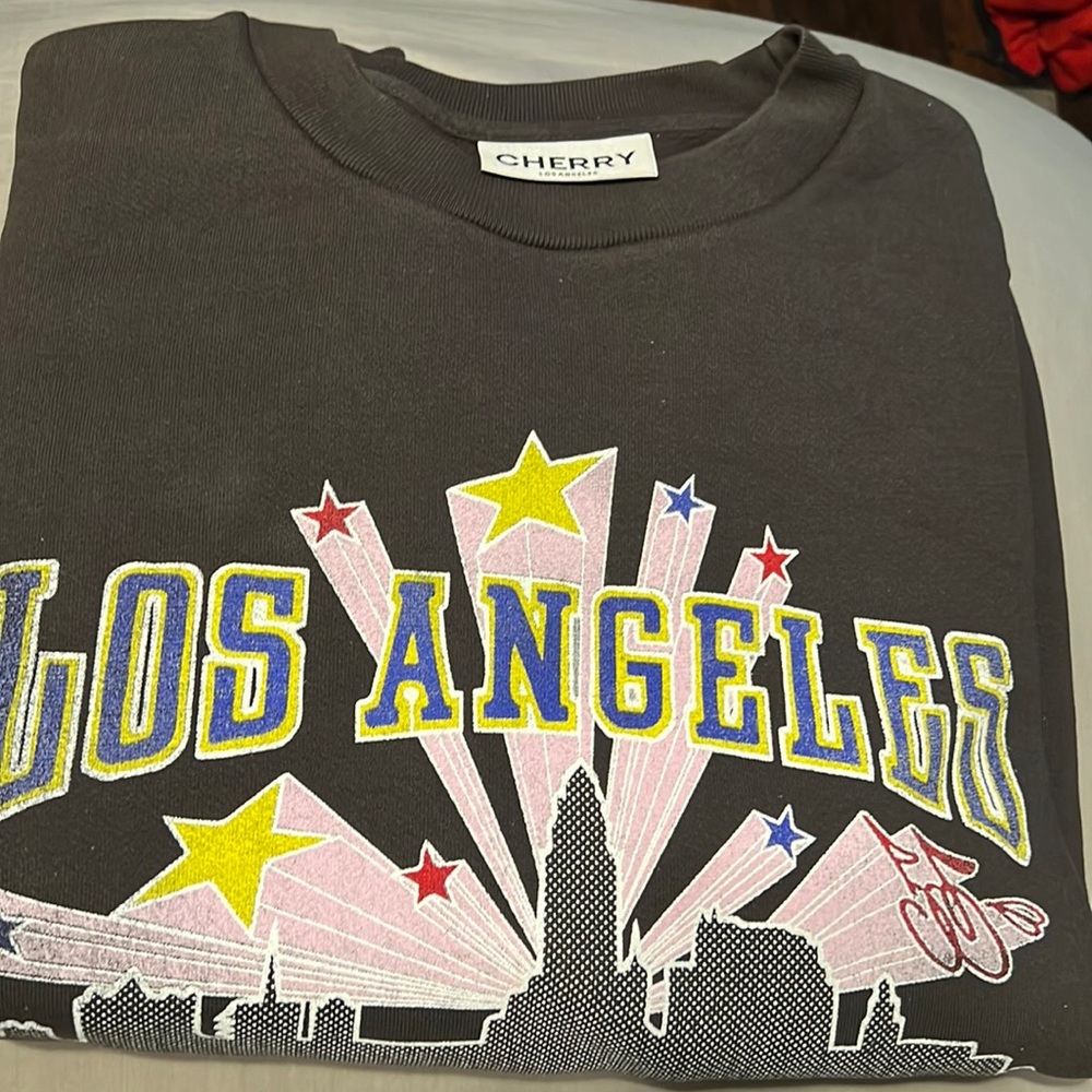 Cherry LA never worn or even unfolded don’t want it